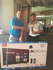 : Mike, our Sales Manager congratulates another flat screen TV winner.